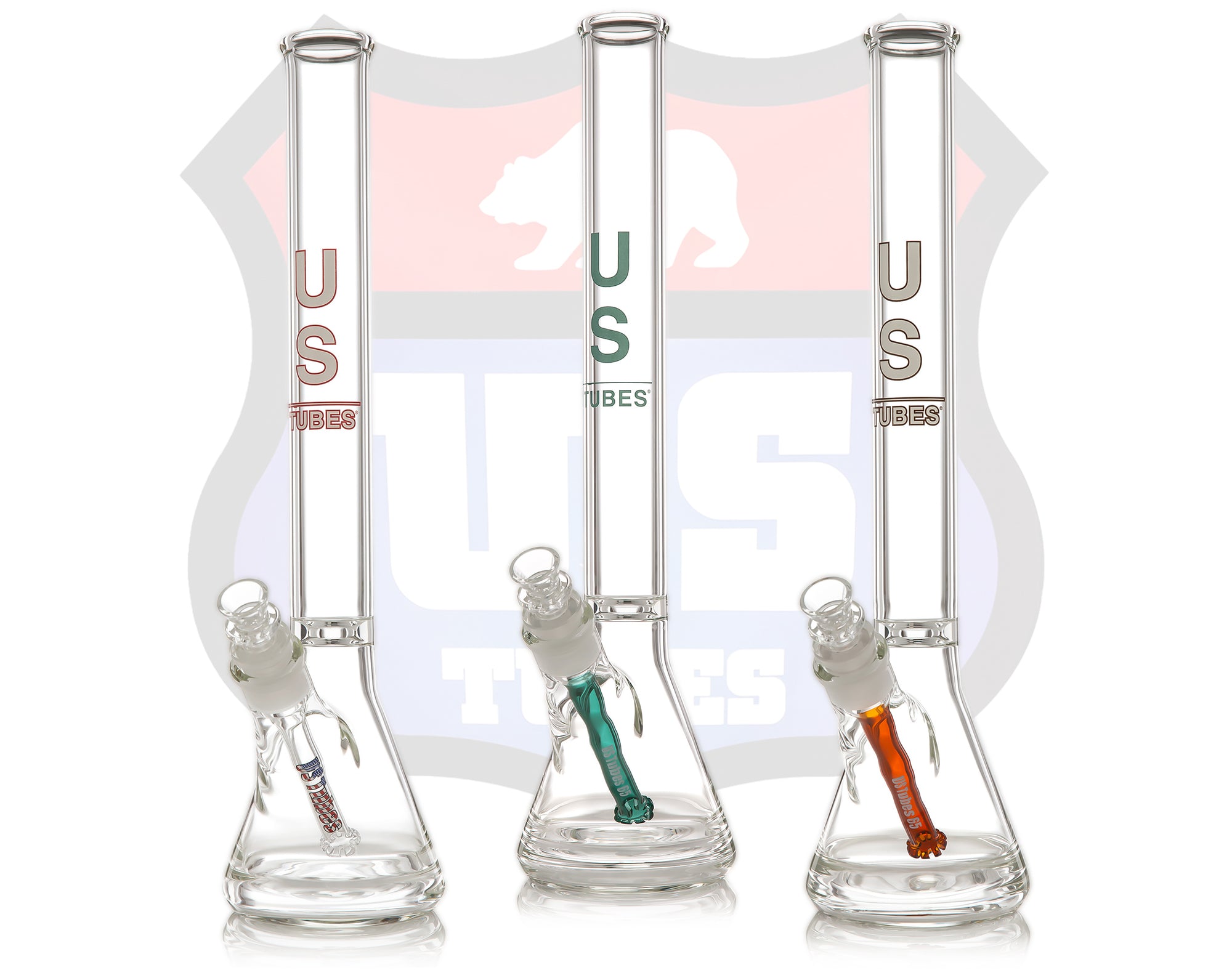 Three Tall US TUBES in front of a faint US TUBES logo
